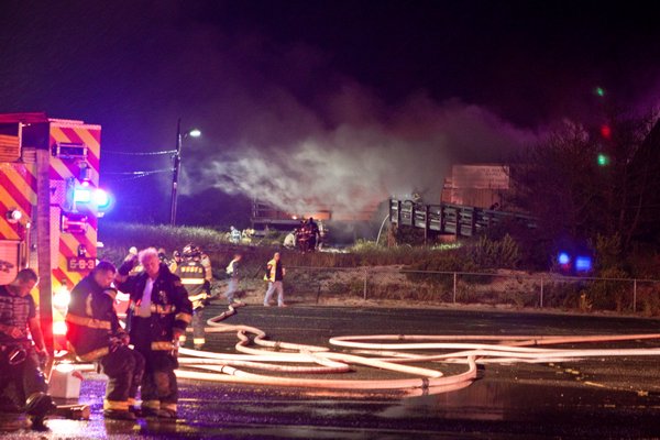 Several fire departments responded to a fire at the Cupsogue Beach Hut in Westhampton Saturday night. Neil Salvaggio