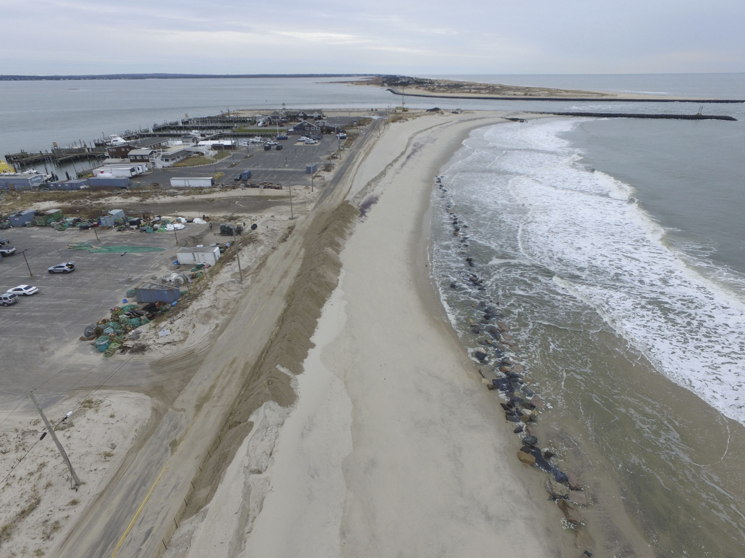A 30-foot section of dune along Dune Road in Hampton Bays has once again been repaired after rough seas from a coastal storm, coupled with the high tide, washed it away on Sunday. 