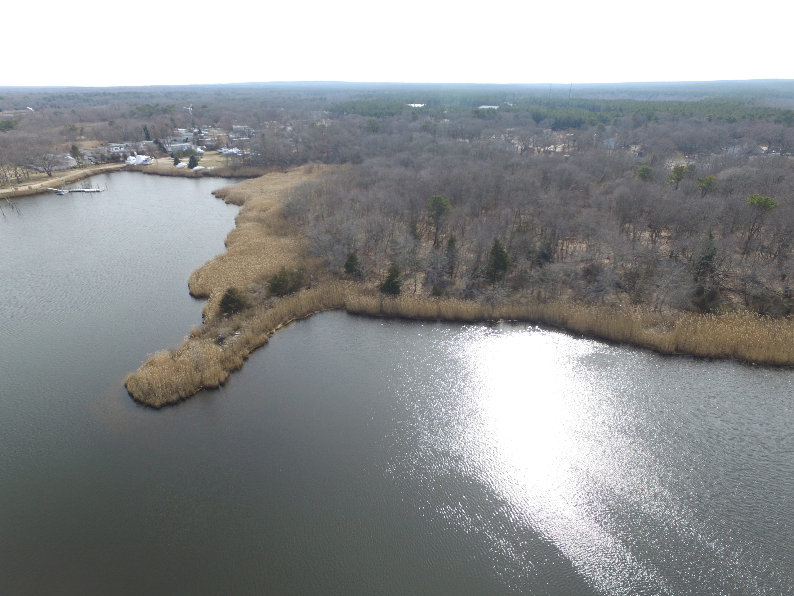 February 28 -- A developer’s plans for her shrinking Riverside property remain in limbo, as they have for nearly 20 years, though, this time, much of that uncertainty can be attributed to the still-unrealized potential in Southampton Town’s most economically distressed hamlet. Dede Gotthelf, who now owns 6.22 acres overlooking the Peconic Riverroughly one-quarter of what she had owned when she began investing in Riverside in the late 1990s—says the planned construction of a sewage treatment plant in the town’s nearby Enterprise Zone could open her remaining land, as well as neighboring properties, to new possibilities. She said those options could potentially include the construction of dozens of new units of much-needed workforce housing in the municipality, or the addition of several new waterfront businesses, possibly restaurants that would overlook the water and sit across from Riverhead Town’s bustling downtown. “I think it is a phenomenal piece of property in the overall attempt to revitalize Riverside, and I think something wonderful should happen with it,” said Ms. Gotthelf, who currently has no formal application in the works. Diana Weir, the town’s director of Housing and Community Development, said she has had several conversations with Ms. Gotthelf regarding her property over the past few months. Citing the pending construction of the sewage treatment plant, Ms. Weir said it is too early to know if it makes sense to build much-needed workforce housing complex on the site. She left open the possibility that there might be better uses for the land, noting that it could be the ideal place to offer outdoor recreational activities, such as kayaking or canoeing.