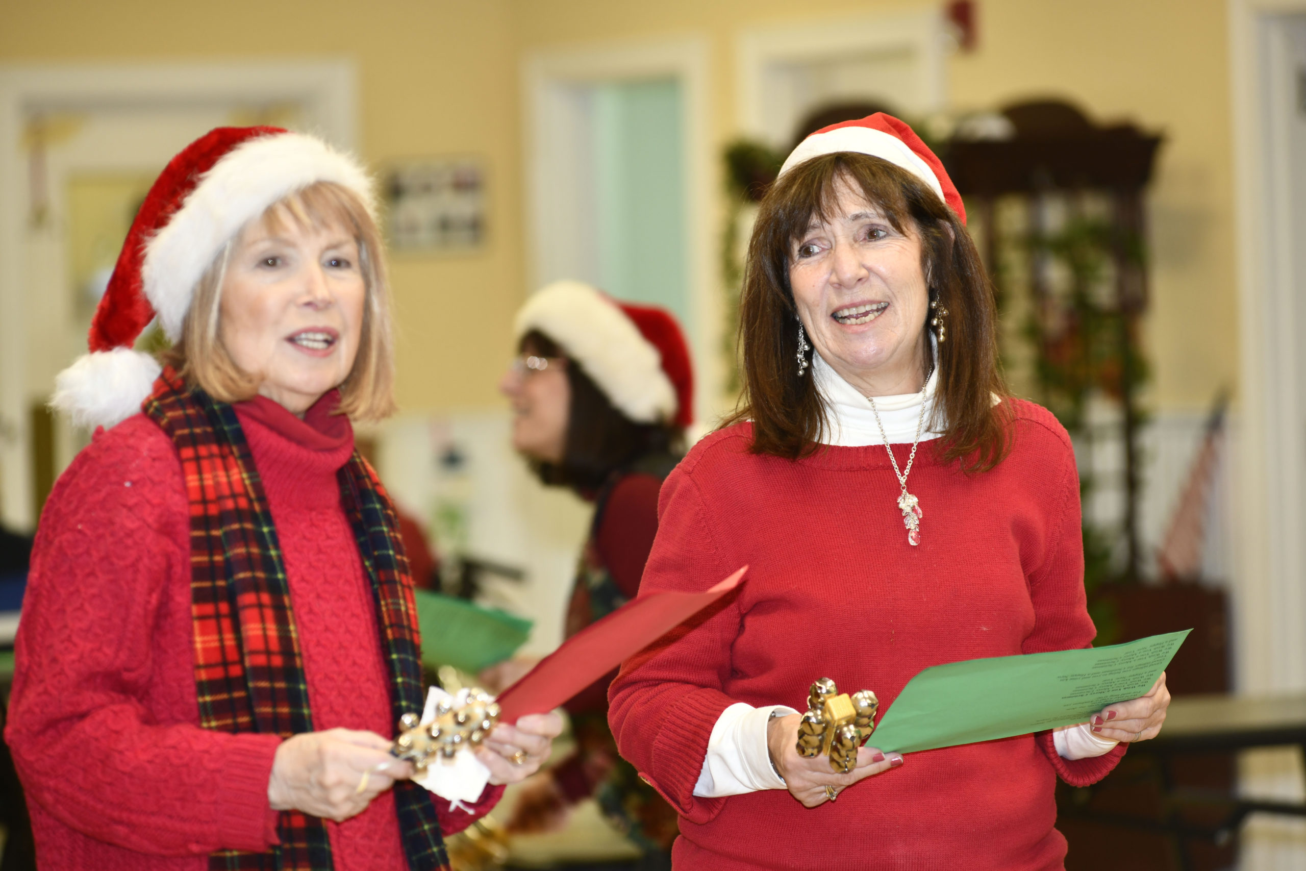 Carolers Gail Zappone and Carolyn Ellis.