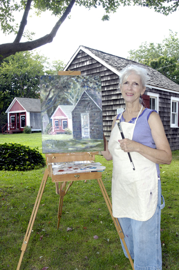 Artist Mary Samuels with the piece that she did for the show at the Southampton Historical Museum. 