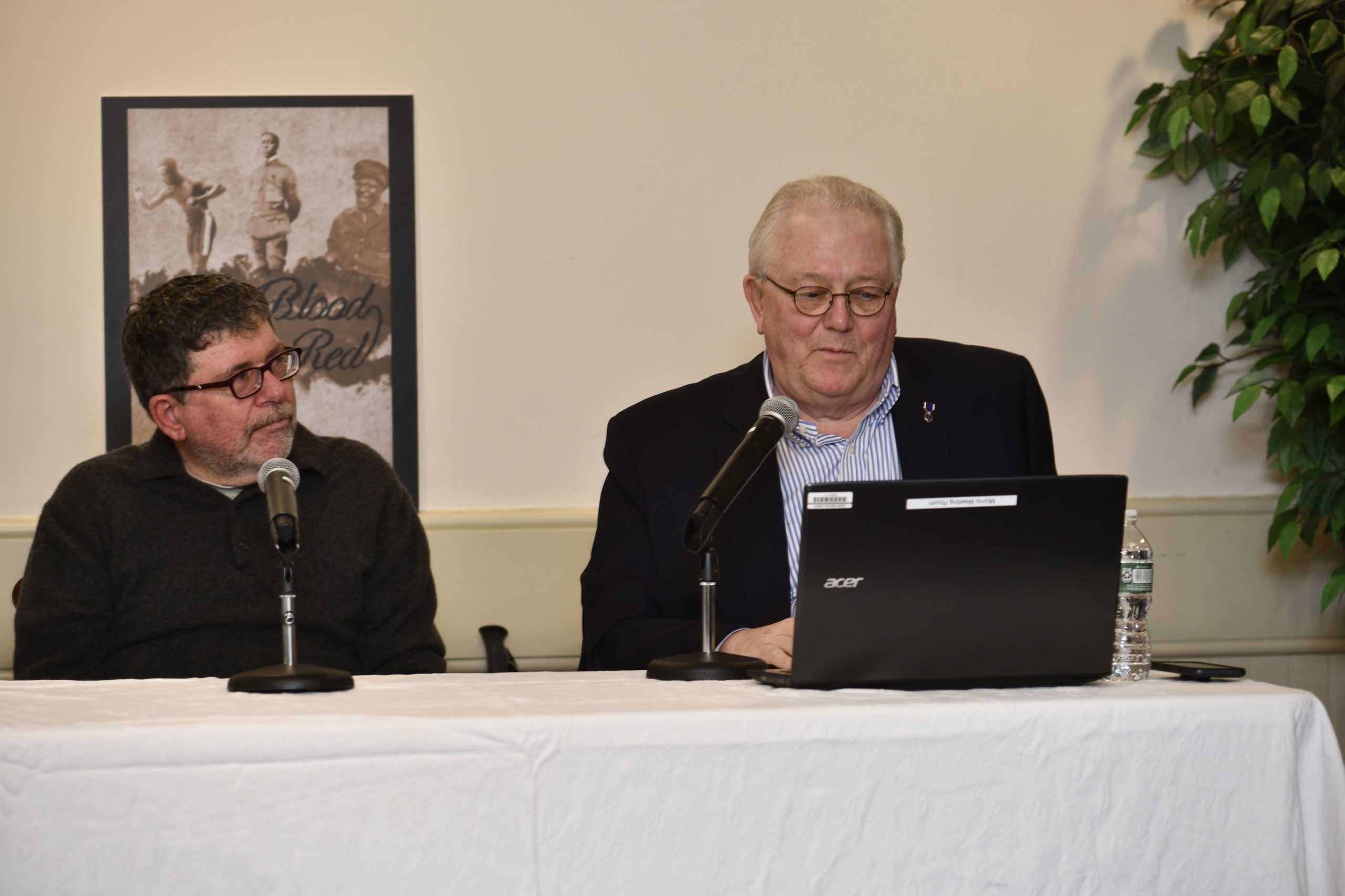 Authors Tom Clavin and Phil Keith talk about their book, “All Blood Runs Red: The Legendary Life of Eugene Bullard — Boxer, Pilot, Soldier, Spy,” at the Rogers Memorial Library in November. DANA SHAW