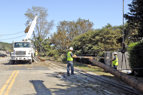 Crews work to repair downed power lines on Montauk Highway in Shinnecock Hills.  DANA SHAW
