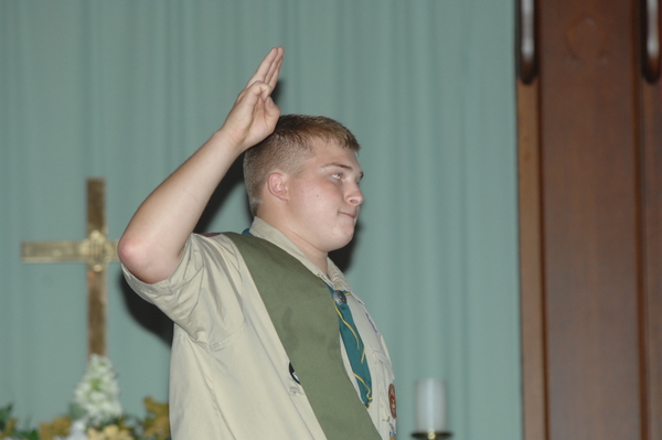 Andy Fowler takes the Eagle Pledge at his Eagle Scout ceremony on Sunday.
