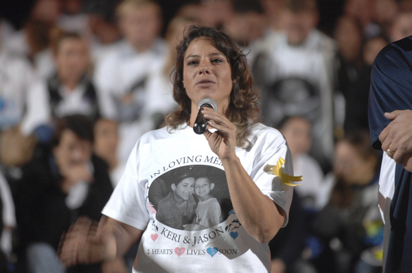 Family cousin Danielle Chavez speaks about Keri and Jason Trinca at the memorial at Eastport South manor High School on Tuesday night.