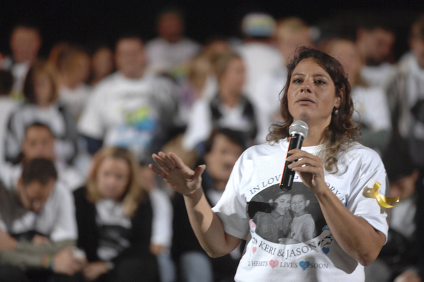 Family cousin Danielle Chavez speaks about Keri and Jason Trinca at the memorial at Eastport South manor High School on Tuesday night.