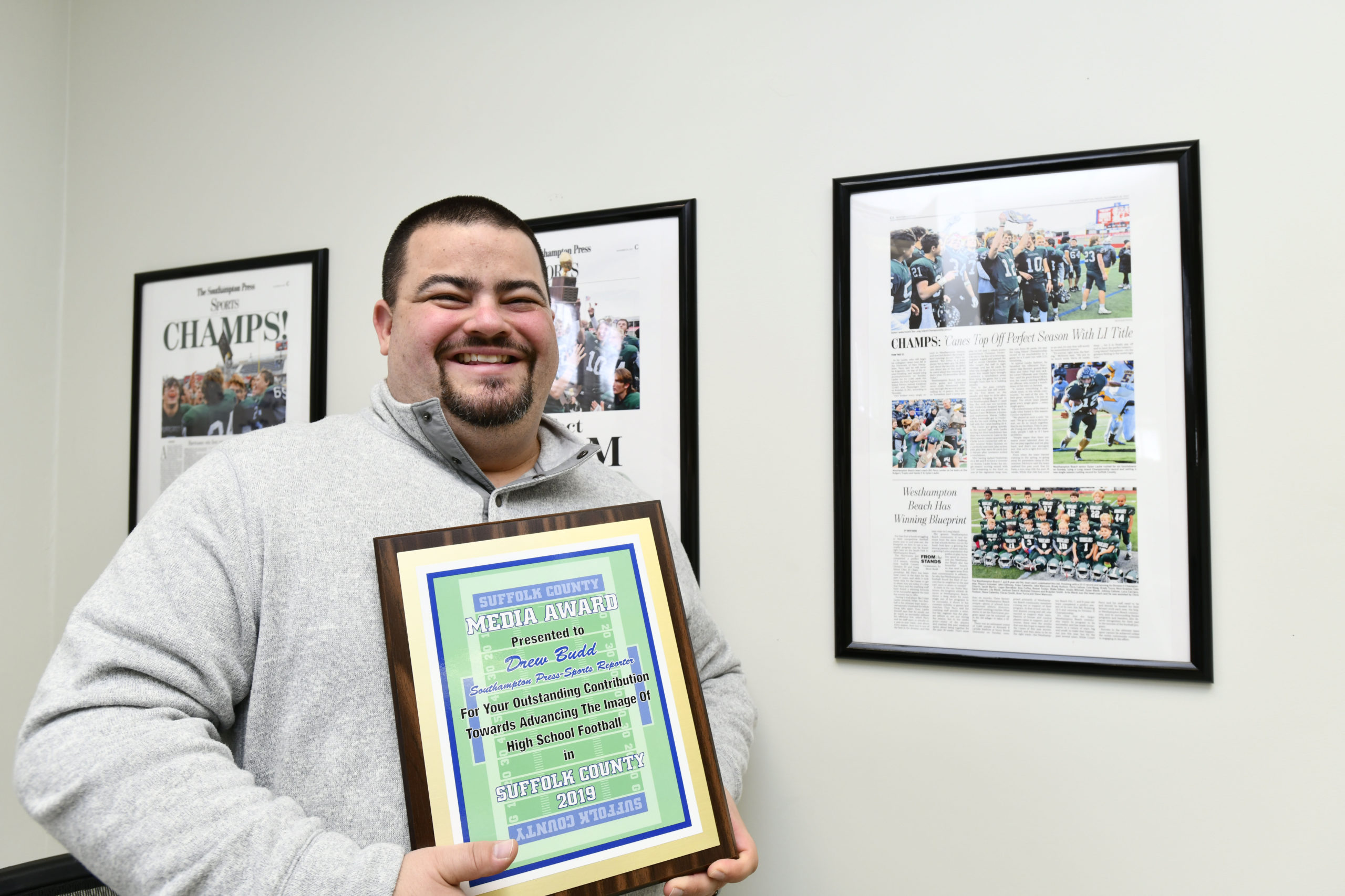 Express News Group Sports Editor Drew Budd was presented with the Suffolk County Football Coaches Association's Media Award at the Suffolk County Football Awards Dinner in Hauppauge on Monday, December 2. Westhampton Beach varsity football head coach Bryan Schaumloffel nominated him for the award, which is presented to someone within the media who shows 