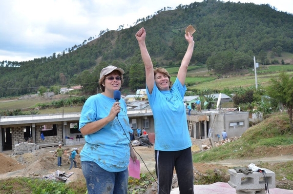 Southampton Intermediate School Assistant Principal Susan Wright pumps her arms with joy near the completion of work on building a school in the Dominican Republic this month.
