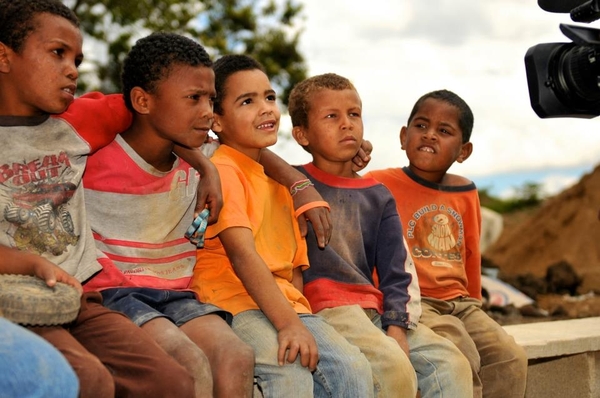 Young boys in the Dominican Republic line up to have their photos taken.
