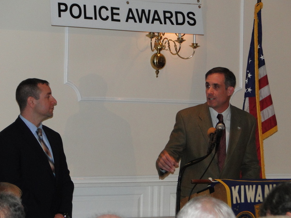 East Hampton Town Police Captain Michael Sarlo presents Police Officer David E. Martin with their department's police officer of the year honors Friday night. 