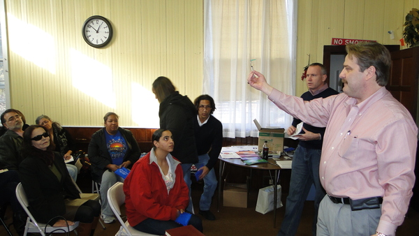 Dr. Thomas Jan demonstrates Saturday afternoon at the Shinnecock Presbyterian Church how to use a syringe to apply naloxone to prevent fatal drug overdoses. 