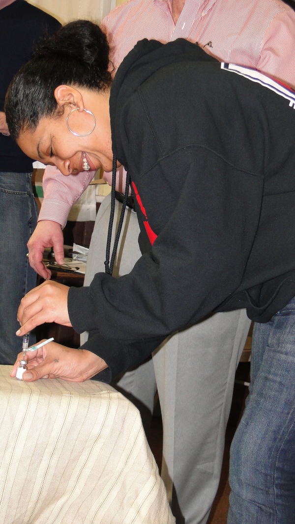 Rachel Valdez practices filling a syringe with naloxone during a drug-overdose-prevention program Saturday at the Shinnecock Presbyterian Church. 