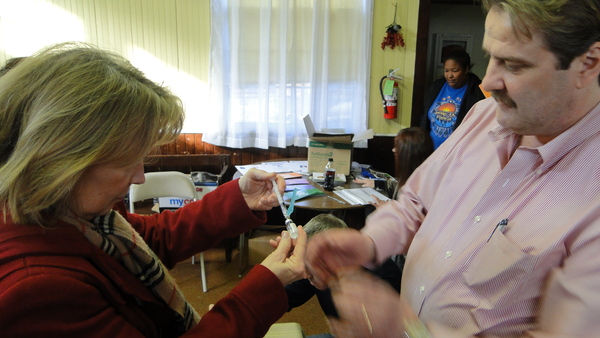 Gail Zappone of Shinnecock Hills practices filling a syringe with naloxone during a drug-overdose-prevention program Saturday at the Shinne