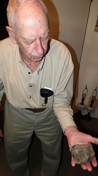 Richard Hendrickson shows off a meteorite in his Bridgehampton home. COLLEEN REYNOLDS