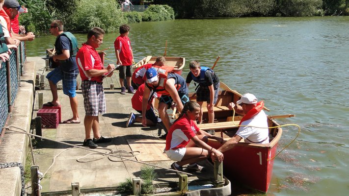 The end of a whaleboat race at the 32nd annual Southampton Fire Department Antique Muster and Parade on Saturday in Southampton Village. COLLEEN REYNOLDS