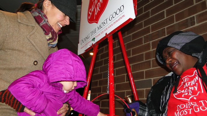 Sharon Campbell sings while she rings for the Salvation Army outside King Kullen in Bridgehampton. Carmen McCulley