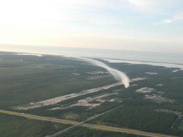 An aerial view of the brush fire at Speonk Earth Recycling on Saturday. COURTESY BEN HUBBARD