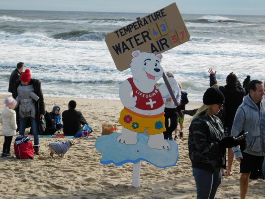  hundreds of brave souls took a brisk ocean dip on New Year’s Day for the 17th annual Polar Bear Plunge at Main Beach in East Hampton. The air temperature was a balmy 57 degrees; the water temperature a less balmy 43 degrees.     TOM KOCHIE