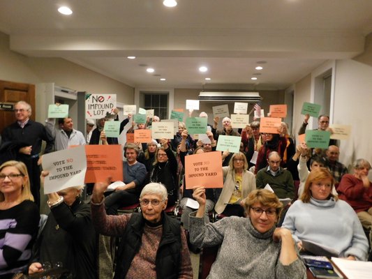 Residents held up signs that said 