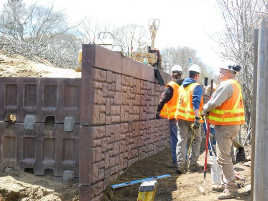 The construction crew was working on building a wall to hold up the tracks on Tuesday afternoon.  ELIZABETH VESPE