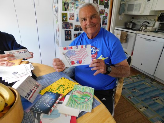 Louis Mosconi showing off some of his thank you cards sent to him from students all across America.   ELIZABETH VESPE