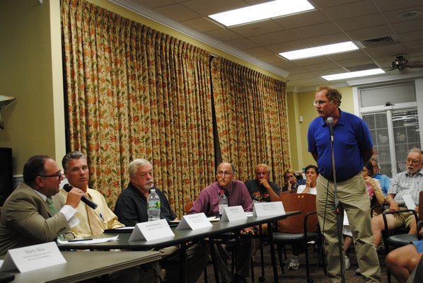  Engineering-Development for T-Mobile on Long Island sat on the panel at the November 4 meeting regarding a proposed cell phone tower at the East Quogue Firehouse. 