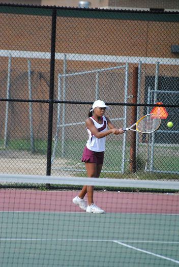 Keynu Banks hits a backhand down the line. 