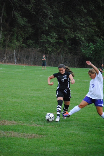 Sophie Gianis of Pierson fights for possession against Port Jefferson. 