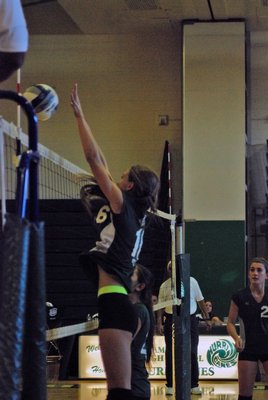Arianna Brierton goes up for a block. DREW BUDD