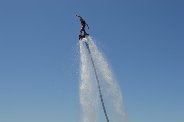 Dane Riva performing on his flyboard above NorthWest Creek. ALISHA STEINDECKER