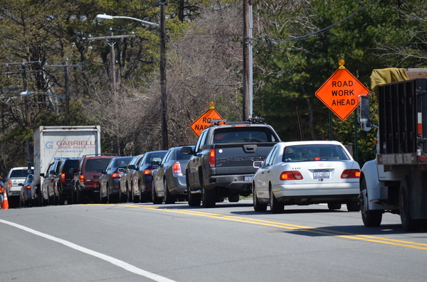 A line of cars traveling eastbound on Montauk Highway wait in traffic due to the Long Island Rail Road bridge construction project. ERIN MCKINLEY