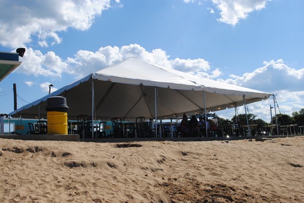 There was a cesspool leak under this tent at the Beach Hut in Hampton Bays on July 10. AMANDA BERNOCCO