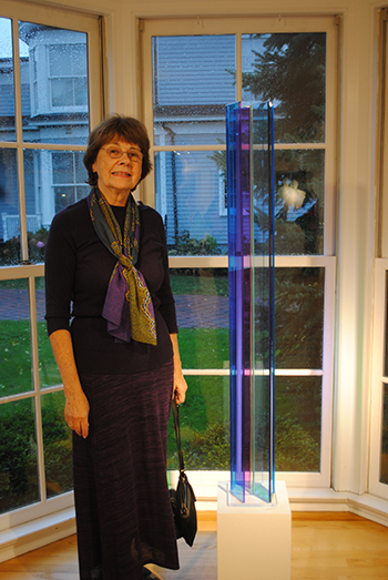 Neva Setlow stands by one of her Plexiglas sculptures on display at East End Arts in Riverhead.