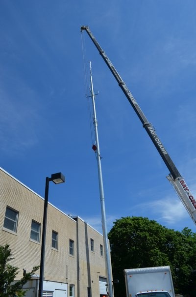 The antenna and pole were installed behind the East Quogue Fire Department on Friday. Alexa Gorman