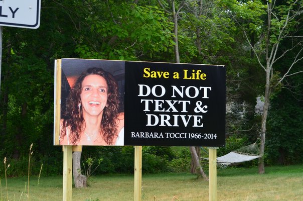 This new sign erected on Flanders Road reminds drivers of the consequences of texting and driving. Alexa Gorman