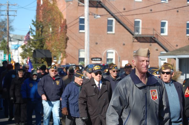 Participants marching in the Sag Harbor Veterans Day Parade. JON WINKLER