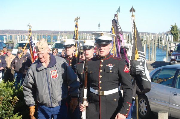 Participants in the Sag Harbor Veterans Day Parade entering the American Legion Post 388. JON WINKLER