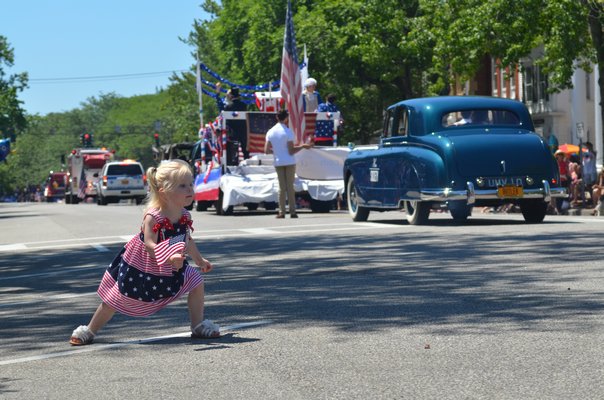 Southampton Village drew a large crowd for the annual Fourth of July parade. Olivia Johnson practiced her pirouettes as the parade went by.