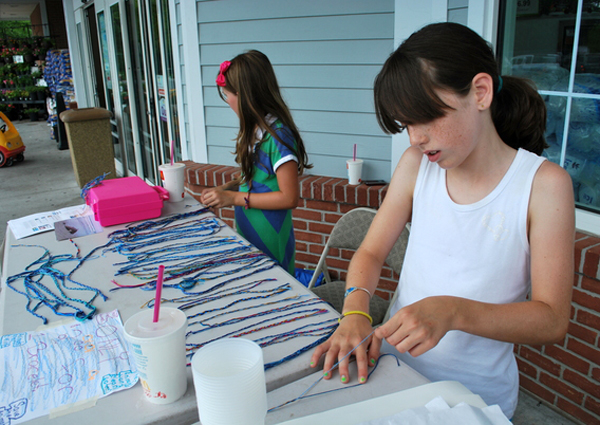 making bracelts to benefit the National Wildlife Federation on Sunday