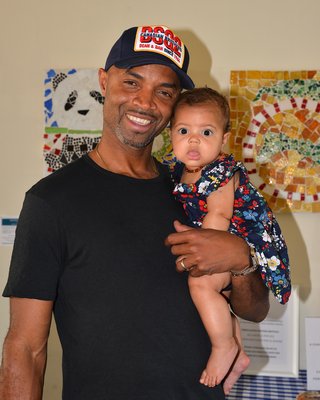 Hayground School in Bridgehampton hosted a benefit picnic on Saturday for Debajo de las Palmas, which helps children and families in the Dominican Republic. Michael and Delanea Guzman were among those attending. KYRIL BROMLEY