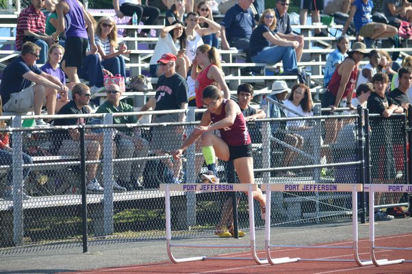 East Hampton's Sadie Ward in the 110-meter hurdles at Port Jefferson High School. Morley Quatroche III