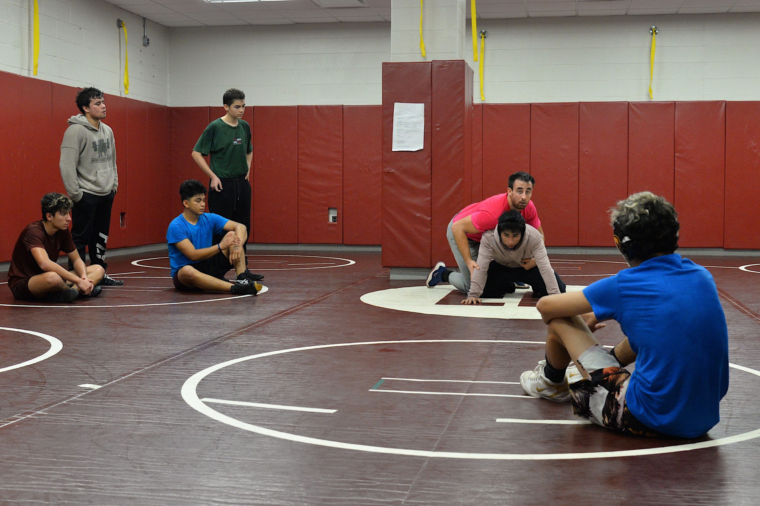 New coach Ethan Mitchell demostrates for his wrestlers.