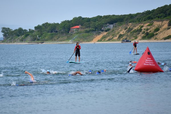 Competitors complete the 300-yard swim portion of Saturday's Turbo Tri held at Maidstone Park in Springs. KYRIL BROMLEY