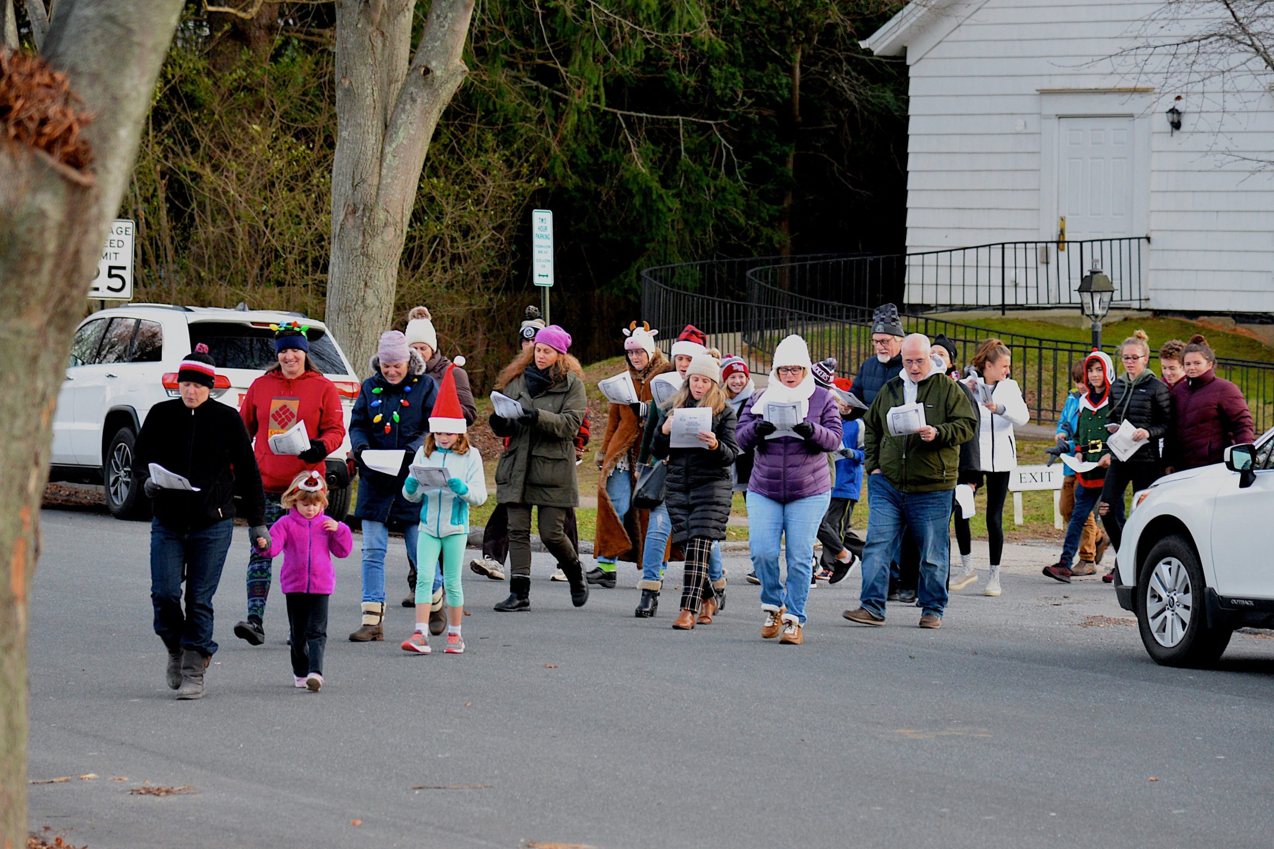Members of the East Hampton Presbyterian Churc set out for a stroll on Sunday to sing Christmas carols in the village business district. KYRIL BROMLEY