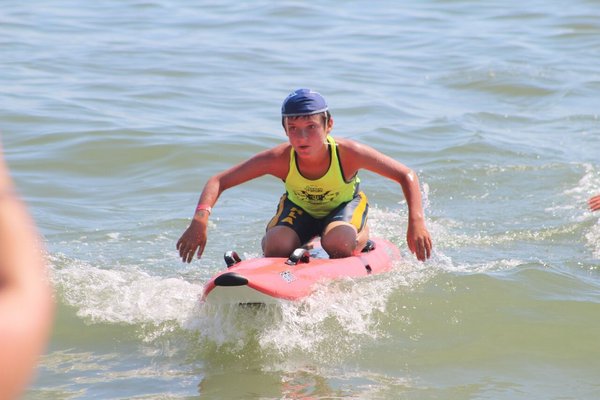 Hamptons Lifeguard Association junior guard paddles into shore. NICOLE CASTILLO