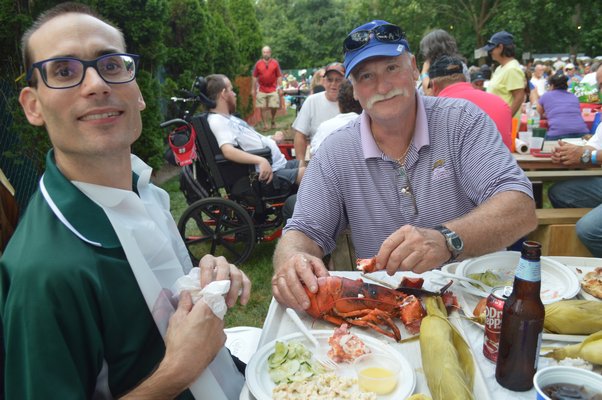  John Dalen and Keith Kostuk prepare some the lobsters served during Saturday's 65th annual barbecue. JENNIFER BIGORA