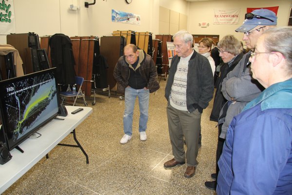 East End residents watched an FAA video explaining helicopter routes between New York City and East Hampton at Riverhead Middle School last week. Michael Wright