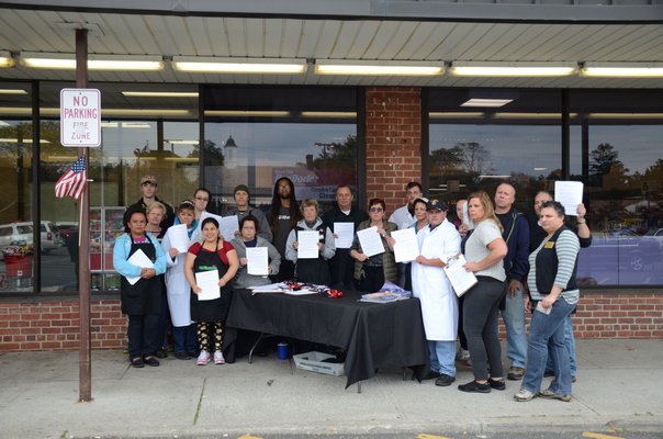 Employees of the Westhampton Beach Waldbaum's supermarket and members of UFCW Local 342 Union stand in front of the bankrupt supermarket