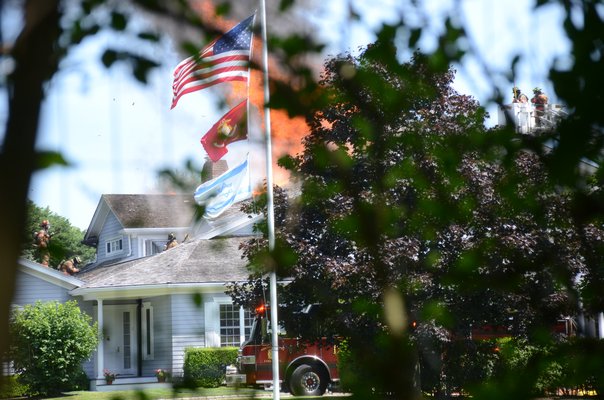 The home at 104 Halsey Neck Lane in Southampton Village became engulfed in flames on Friday