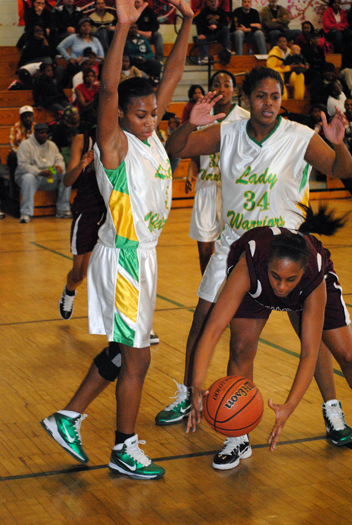 Southampton’s Kesi Goree is defended by Wyandanch players. 